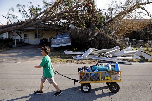 Hurricane Michael brought 250km/h winds and destroyed many properties, killing 17 and stretching food and water supplies.