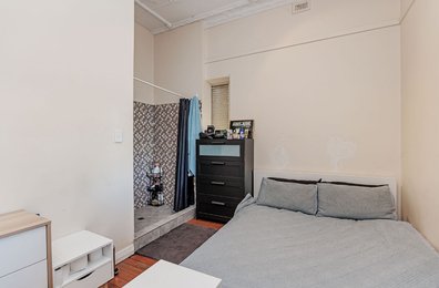 Baffling design layout in this Adelaide home sees the shower literally just a footstep or two away from the bed.