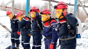 Rescuers prepare to work at a fire scene at a coal mine near the Siberian city of Kemerovo, about 3000 kilometres east of Moscow.