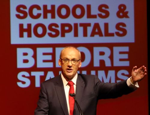 Luke Foley stands in front of Labor's slogan. (AAP)