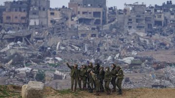 Israeli female soldiers pose for a photo on a position on the Gaza Strip border, in southern Israel, Monday, Feb. 19, 2024. 