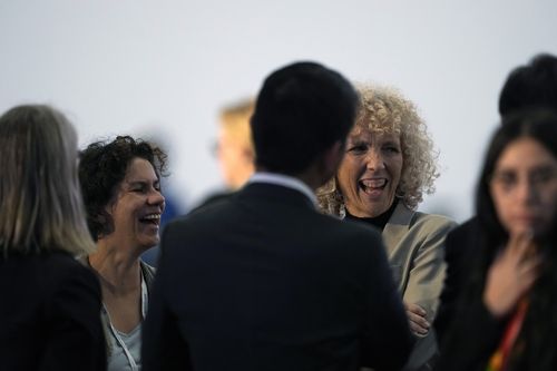 Maisa Rojas, minister of environment of Chile, left, and Germany's climate envoy Jennifer Morgan laugh ahead of a closing plenary session at the COP27 U.N. Climate Summit, Sunday, Nov. 20, 2022, in Sharm el-Sheikh, Egypt. (AP Photo/Peter Dejong)