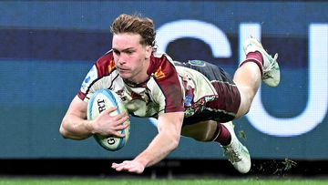 Tim Ryan of the Reds dives over to score a try during the round 14 Super Rugby Pacific match between Queensland Reds and Western Force.
