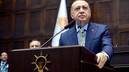 Turkish President Recep Tayyip Erdogan addresses the parliament in Ankara.