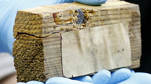 A block of wood with a bullet embedded was another artefact uncovered inside the time capsule.  