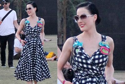 In a vintage gingham pattern dress, Dita dresses like she always does, and as always, the look is babin’.<br/><br/><i>Dita Von Teese at Coachella Festival 2012<br/>Image: Snappermedia</i>