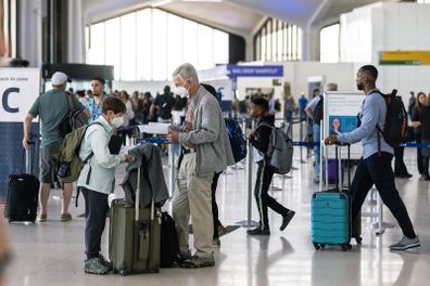 NEWARK, NJ - JULY 01: Travelers line up to check in for United Airlines flights at Newark Liberty International Airport (EWR) on July 1, 2022 in Newark, New Jersey. Hundreds of flights were canceled across the US ahead of July Fourth weekend. (Photo by Jeenah Moon/Getty Images)