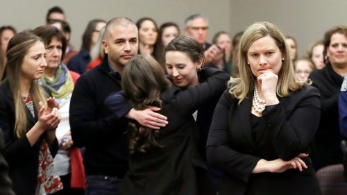 Former gymnast Rachael Denhollander is hugged after giving her victim impact statement. Picture: AP