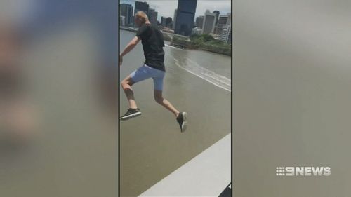 Video shows Mr Erin leaping from Goodwill Bridge into the Brisbane River.  (Luke Erwin 23 / Facebook)