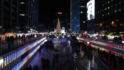 People walk among illuminated decorations at Cheonggye street during New Year's Eve celebrations in Seoul, South Korea.