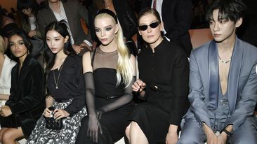 Haerin, left, Anya Taylor-Joy, Rosamund Pike and Tony Yu attend the Dior pre-fall 2024 fashion show at the Brooklyn Museum on Monday, April 15, 2024, in New York. (Photo by Evan Agostini/Invision/AP)