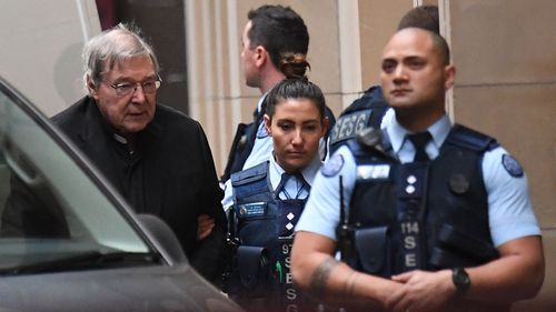 Pell was flanked by armed guards for his arrival to court.