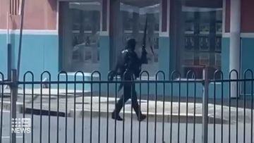 Masked man armed with a rifle allegedly opened fire at pedestrians in a street south of Sydney.