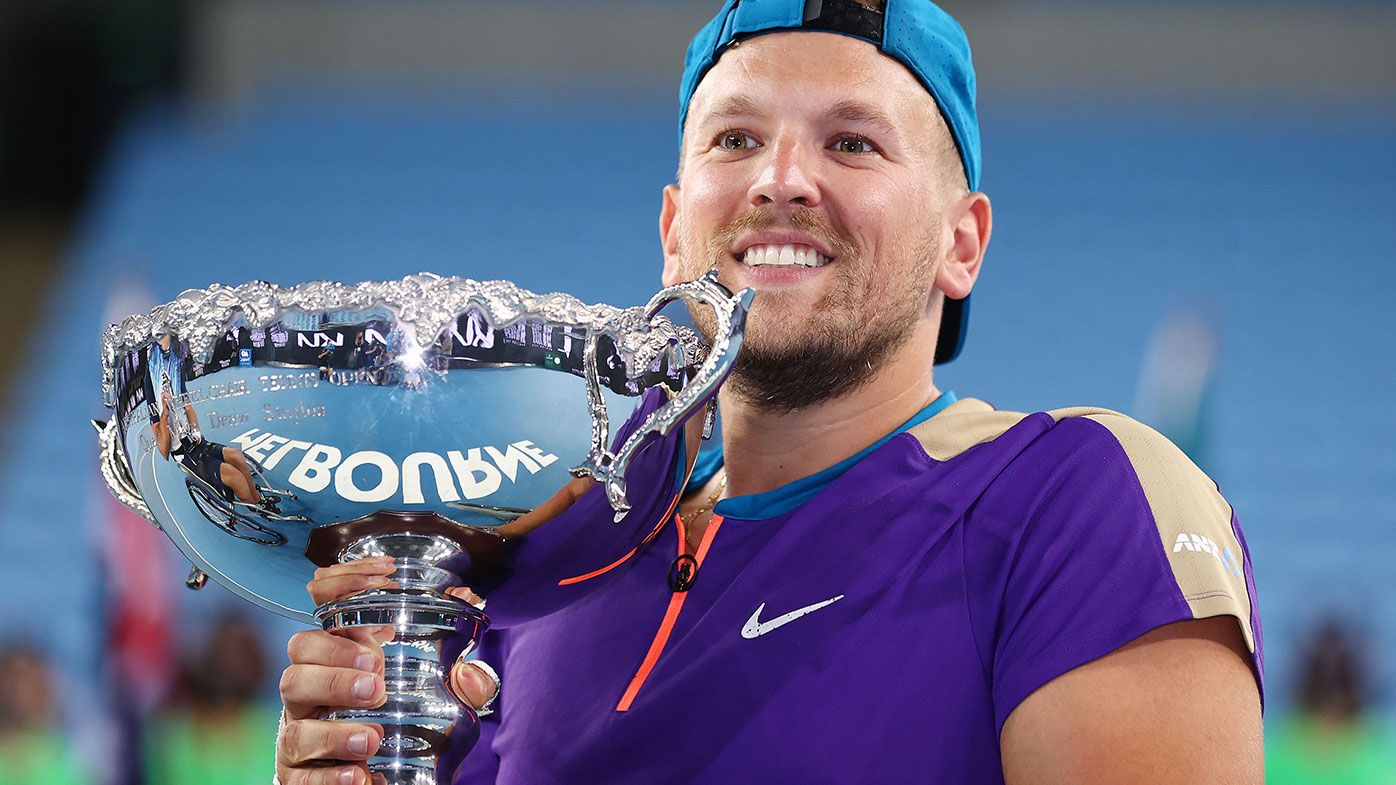 Dylan Alcott of Australia poses with the championship trophy after winning his Quad Wheelchair Singles Final match against Sam Schroder of the Netherlands 