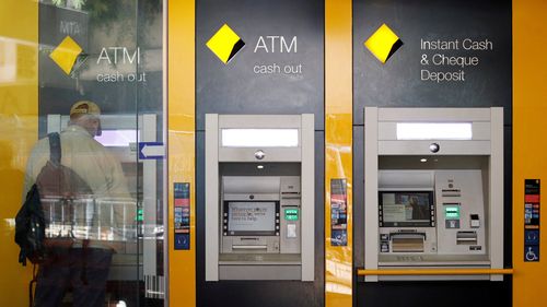 A man uses a Commonwealth Bank of Australia ATM in Sydney, Australia, April 19, 2018.