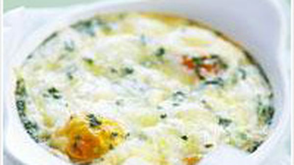 Baked eggs with herbs and fetta