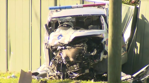 The police car crashed into a ute en-route in Caboolture, in the Moreton Bay region of Queensland. 