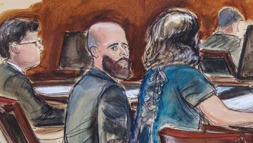 In this courtroom sketch, Joshua Schulte, center, is seated at the defense table flanked by his attorneys during jury deliberations, March 4, 2020, in New York.