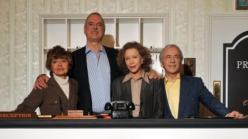 Actors Connie Booth, John Cleese, Andrew Sachs and Prunella Scales pose for photographs as the original cast members of the British comedy programme 'Fawlty Towers' attend a media conference in 2009. (AFP)