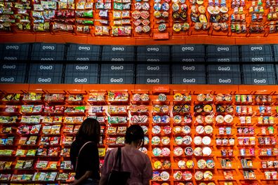 People browse instant noodles at the Good Noodle store in Bangkok, Thailand, March 21, 2022.  