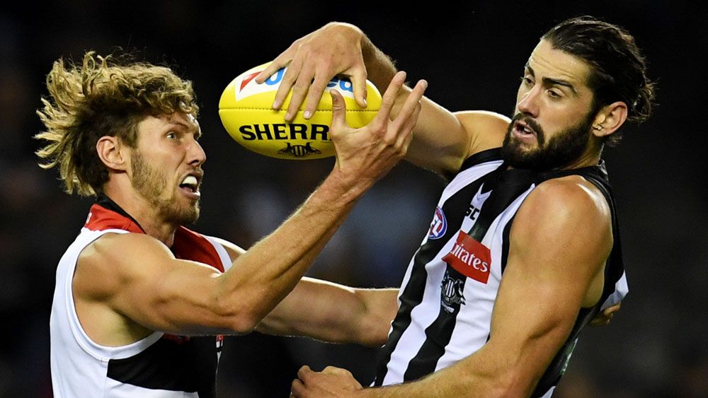 St Kilda's Tom Hickey and Collingwood's Brodye Grundy battle for the ball. (AAP)