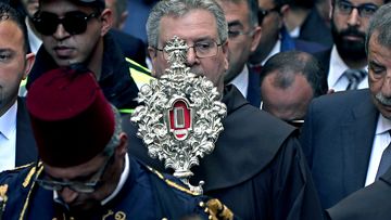 Franciscan friars of the Custody of the Holy Land take part in a procession with a small piece of the Relic of the Holy Crib of the Child Jesus, a gift from Pope Francis to the Custody of the Holy Land, to the church of St Saviour, in the West Bank city of Bethlehem.