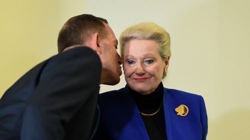 Tony Abbott leans in to kiss former Speaker Bronwyn Bishop. (AAP)