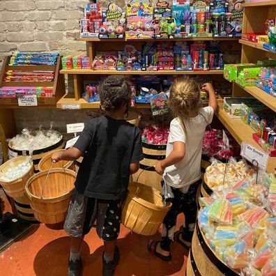 Reign and Saint picking out sweet treats at a local candy store.