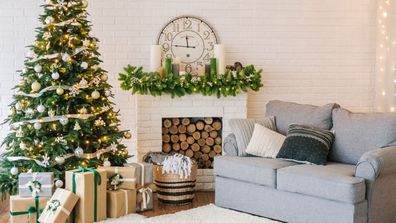 Christmas decorations and a garland on the tree in a living room