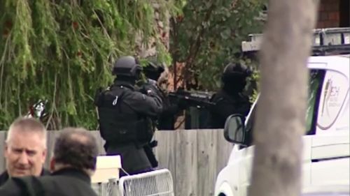 Special Operations Group police outside the Dandenong South house. (9NEWS)