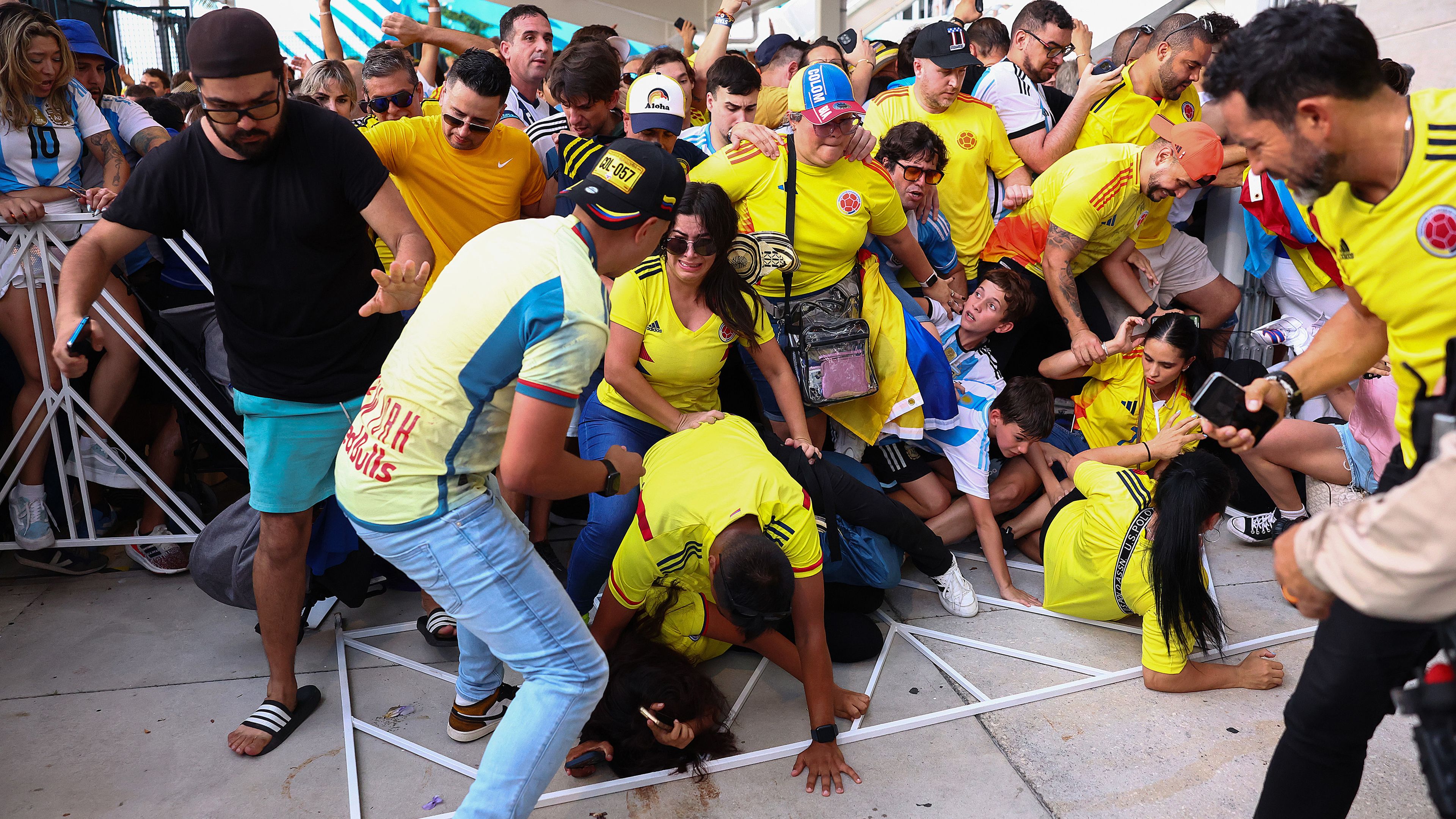 Fans of Colombia and Argentina try to pass the gate amid disturbances ahead of the Copa America 2024 final.