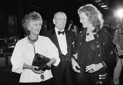 FILE - Actor Laurence Olivier, center, with his wife Joan Plowright, left, and actress Lauren Bacall at the US premiere of Lord Olivier's only Shakespearean production made exclusively for television, "King Lear" in New York, May 3, 1983. (AP Photo/Carlos Rene Perez, File)