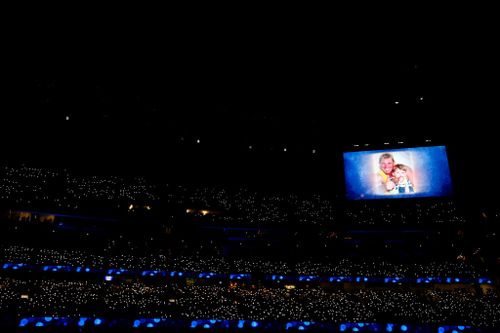 A photo of Shane Warne is seen on the big screen during the state memorial service.