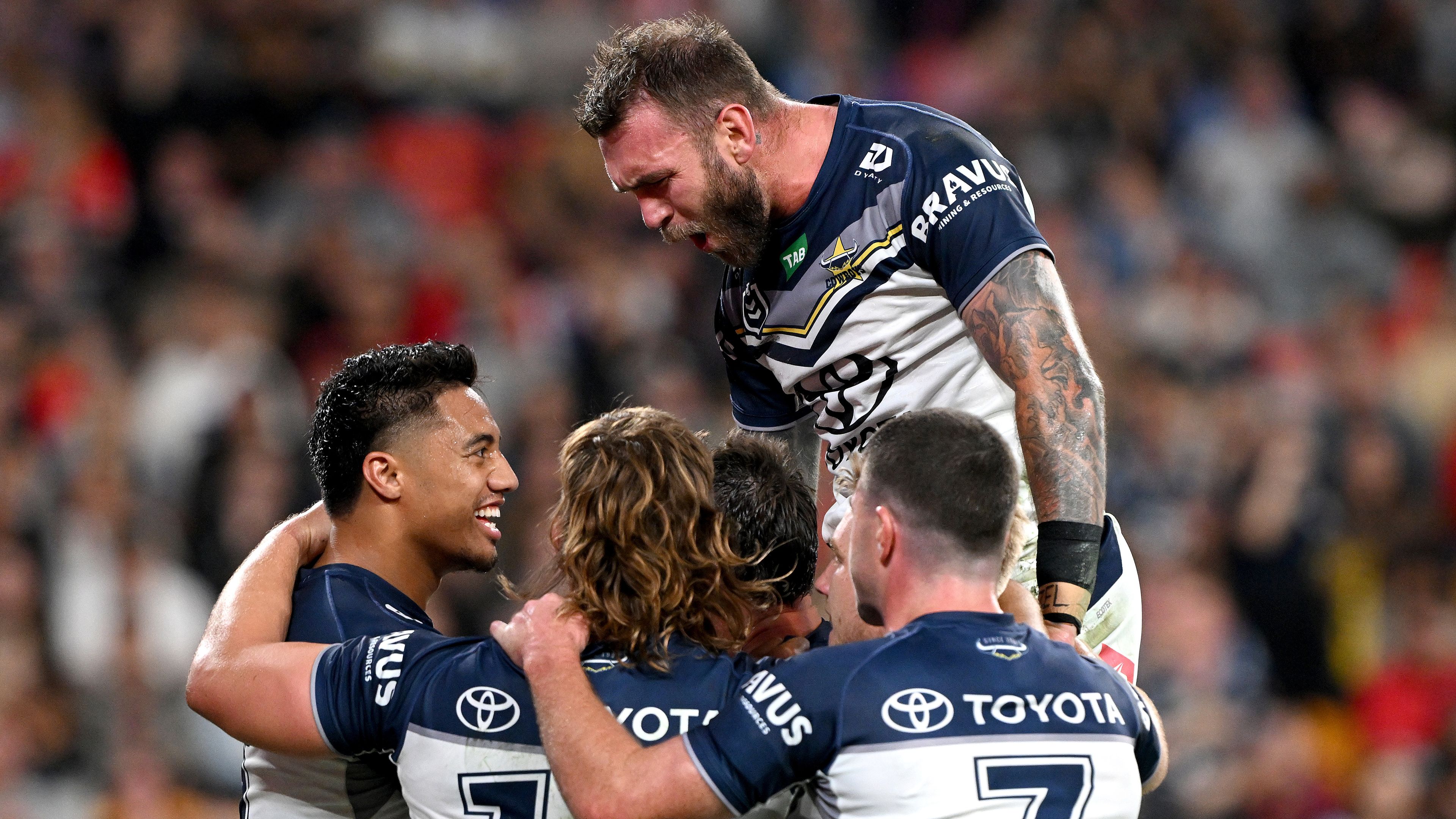 Scott Drinkwater of the Cowboys is congratulated by team mates after scoring a try during the round 26 NRL match between Dolphins and North Queensland Cowboys at Suncorp Stadium on August 25, 2023 in Brisbane, Australia. (Photo by Bradley Kanaris/Getty Images)