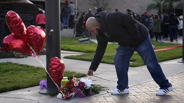 Pastor Abner Ramos pays his respects at a gathering to honor the victims killed in Saturday&#x27;s ballroom dance studio shooting in Monterey Park, California.