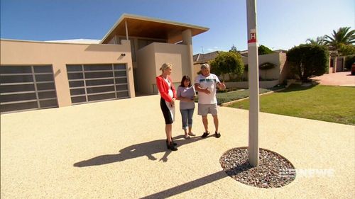 Antonio and Nancy Grasso say the lamp post is a hazard. (9NEWS)