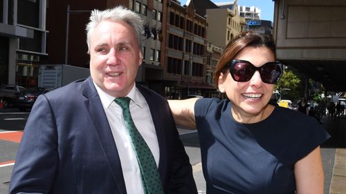 Cranston and his wife joyous outside court this morning.