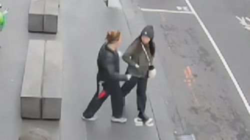 CCTV footage has shown the moment a woman was randomly stabbed in broad daylight while walking to work at a sushi restaurant in Melbourne's CBD. ﻿