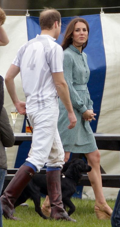 The Cambridges walk Lupo after William and Harry played a charity polo match at Coworth Park Polo Club on May 13, 2012.