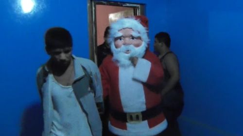 Police officer disguised as Santa Claus conducts surprise drug raid in Peru