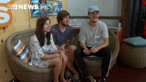 Alexander Jensen, Julie Lelund and Neikolaj Nielsen had been travelling around Australia for six months when they were stopped in their tracks. (9NEWS)