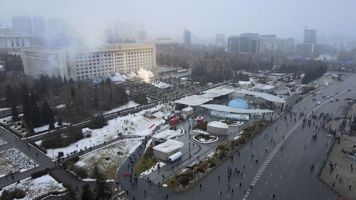 Smoke rises from the city hall building during a protest in Almaty, Kazakhstan, Wednesday, Jan. 5, 2022.
