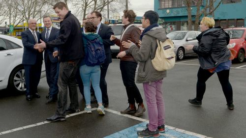 Security intervene as protesters attempt to stop Christopher Pyne from entering Victoria University campus