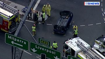 The driver of the car was briefly trapped after the collision. (9NEWS)