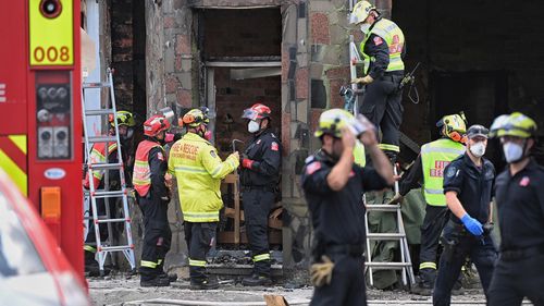 Fire and Rescue and Police investigate the fire which killed at least three people in Newtown, Sydney.