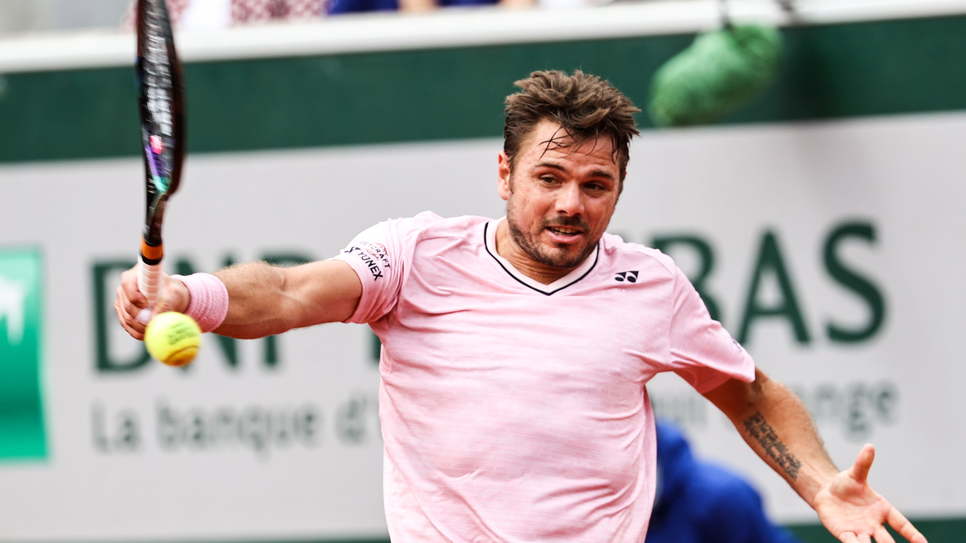 Switzerland&#x27;s Stan Wawrinka plays a backhand against France&#x27;s Corentin Moutet during their opening clash at Roland-Garros.