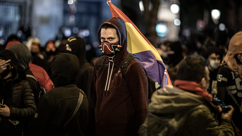 A protestor attends a march in support of imprisoned rap artist Pablo Hasel on February 21, 2021 in Barcelona, Spain. (Photo by Finbarr O'Reilly/Getty Images)