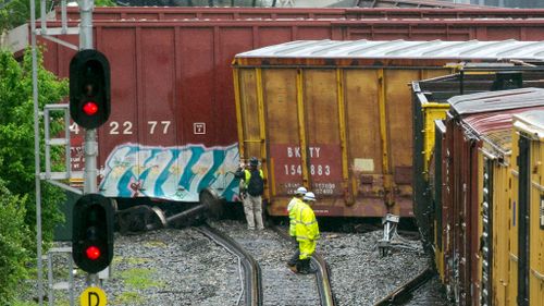 Derailed US train leaks hazardous material