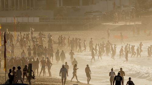 SYDNEY, AUSTRALIA - NOVEMBER 27: A packed Bondi Beach at sunrise on November 27, 2024 in Sydney, Australia. Some Australians experienced temperatures of 40 degrees plus last weekend.