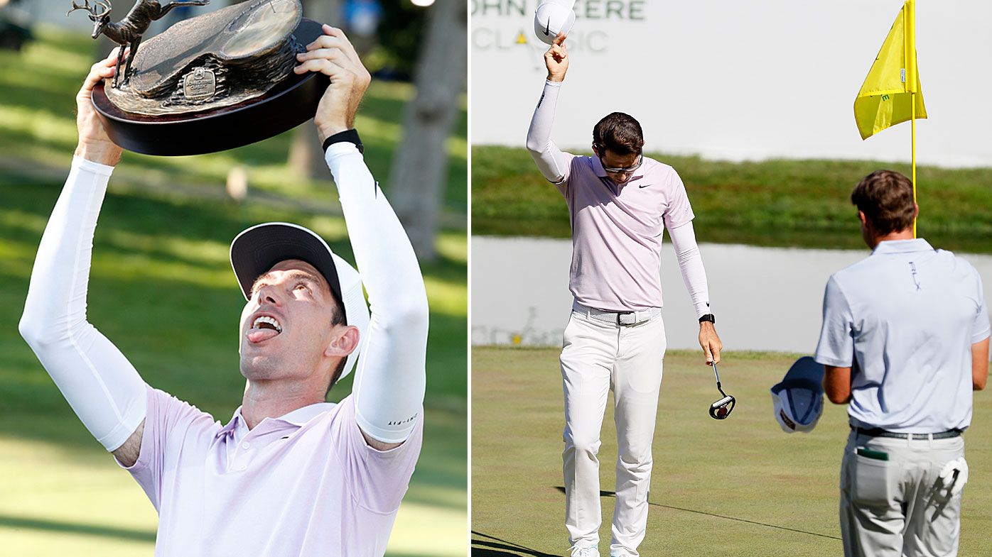 Dylan Frittelli holds the trophy after winning the John Deere Classic 